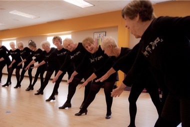 The Born To Dance tap ensemble of The Sun City Strutters practices their rou- tine at a recent rehearsal for their annual spring performance Dance~Dance. (Photo by Chris LaPelusa/Sun Day)