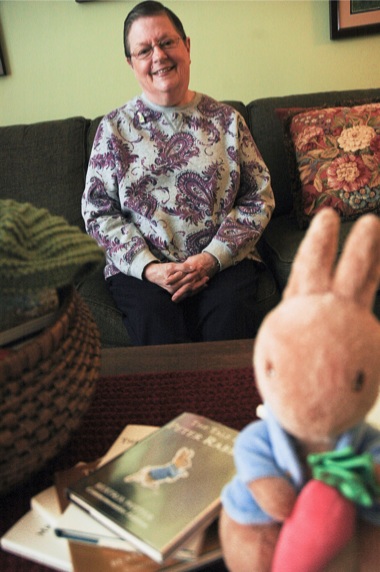 Sarah Hudgens of Neighborhood 3 discovered author Beatrix Potter when she was only three years old, growing up in Elgin. Since then, her passion for Peter Rabbit and other stories by Potter has hopped through the decades. (Photos by Chris LaPelusa/Sun Day)