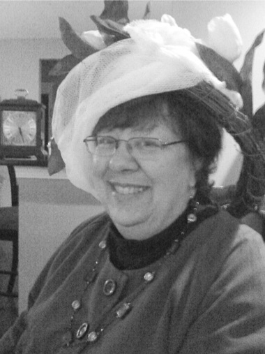 Host Kay Sorensen sportingg a makeshift hat made of grapevine wreath wrapped in mesh. (Photo provided)