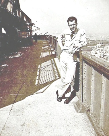 Dan Glaubke during his army days, posing while standing on top of the Eiffel Tower. (Photo provided)