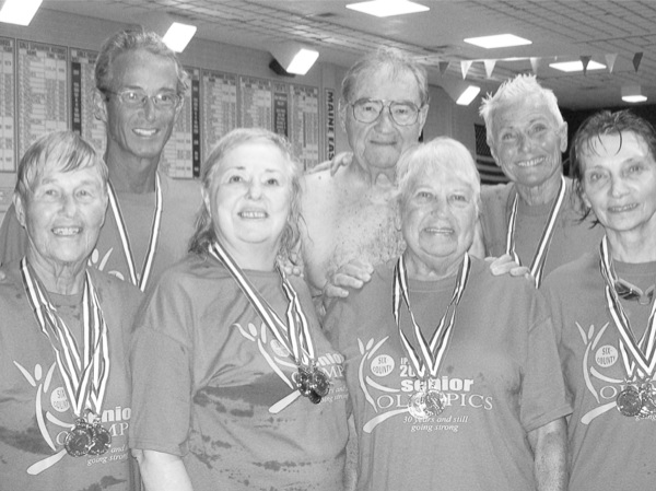 Stingrays' Swim Club members at the Park Ridge Swim and Track Meets are (first row, left to right) Caryl Fabian, Margarete Liedtke, Joan Souchek, and Ginny McCann; (back row, left to right) Len Lencioni, Joe Loughlin, and Joanie Koplos. Missing from the picture are swim participant, Art Fitzgerald and track participant, Nick Koplos. (Photo provided)