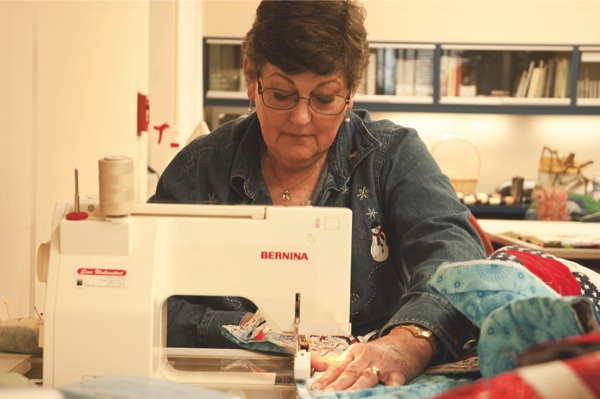 Originally from occupied Denmark, Sun City resident Liss Kundich turns the hobby of quilting into a selfless act of humanity, making and sewing hundreds of quilts with groups such as Project Linus for those in need all over the world. (Photo by Chris LaPelusa/Sun Day)
