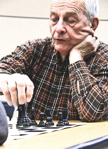 Chess Club members contemplate moves ahead. (Photos by Hannah Sturtecky/Sun Day)