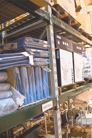 Mattress pads are stacked in the warehouse of Advantage Medical Equipment. The facility also holds wheelchairs, hospital beds, breathing devices, and more. (Photo by Chris LaPelusa/Sun Day)