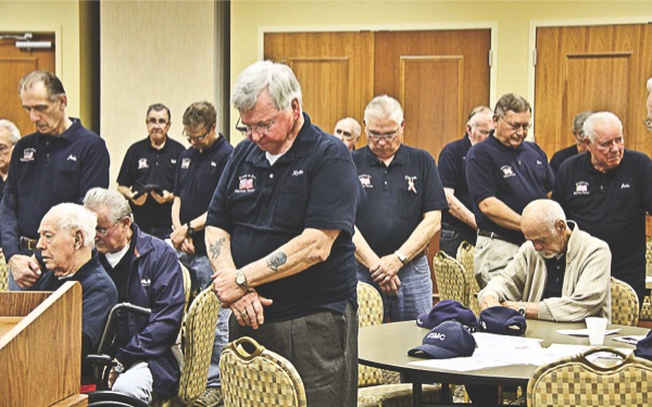 Members of the Elgin Veterans group pause for a moment of reflection before the start of their May 2 meeting. The group consists of about 110 members and meets on the first Wednesday of every month. (Photo by Hannah Sturtecky/Sun Day)