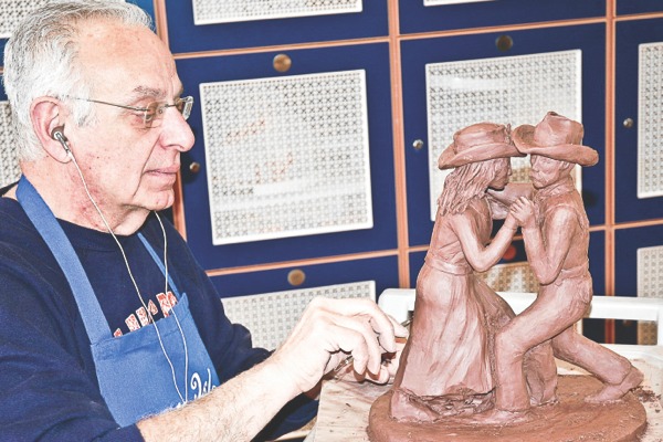 Clayground president Nick Damlas works on a statue. (Photo provided)