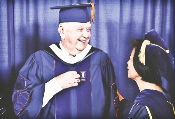 Orion Samuelson stands with Chancellor Phyllis Wise of the University of Illinois during the school’s graduation ceremonies on May 31. Samuelson was the afternoon commencement speaker. (Photo provided)