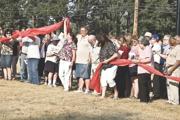 Village officials and Huntley residents gather at Deicke Park to celebrate the ribbon cutting for the widened Route 47. (Photo by Chris LaPelusa/Sun Day)