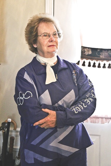 June Ann Cooney carried the torch in Chicago in preparation for the 2002 Olympics in Salt Lake City. (Photo by Hannah Sturtecky/Sun Day)