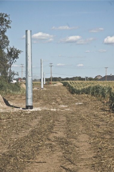 ComEd powerline masts erected along Kreutzer road. (Photo by Chris LaPelusa/Sun Day)