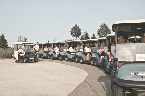 Couples line up in their golf carts in anticipation for the Couples Golf Tournament’s shotgun start. (Photo by Mason Souza/Sun Day)