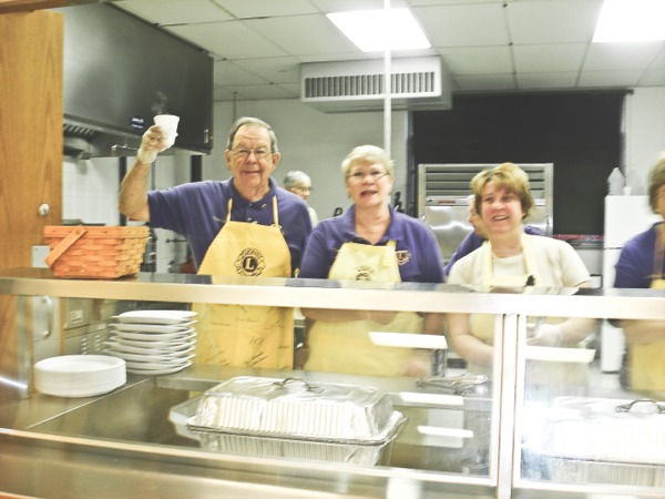 Lions Club members work together during a previous pancake breakfast. (Photo provided)