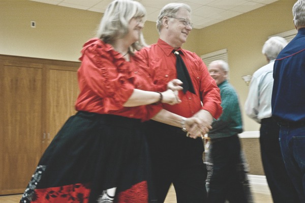 Couples take to the floor to dance during the Edgewater Squares during their October 4 meeting. Square dancing has unique, universal calls, always spoken in English. (Photo by Chris LaPelusa/Sun Day)