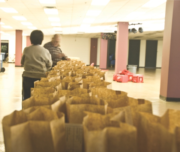 Golden Diners volunteers help package meals to be sent to distribution centers. According to Salvation Army Maj. Ken Nicolai, the program serves between 700-800 meals every day. (Photo by Mason Souza/Sun Day)