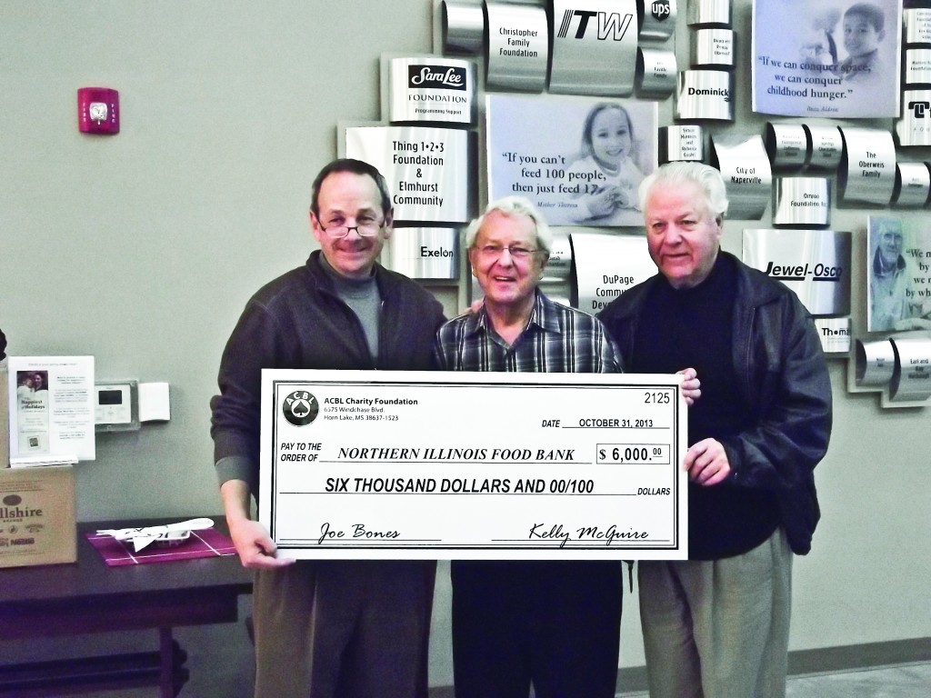 L to R: Pete Schaeffer, CEO Northern Illinois Food Bank, Karl D Dencker, President American Contract Bridge League (ACBL)Unit 239 and Ronald Hopman, Unit 239 Board Member and resident of Sun City Huntley. (Photo Provided)