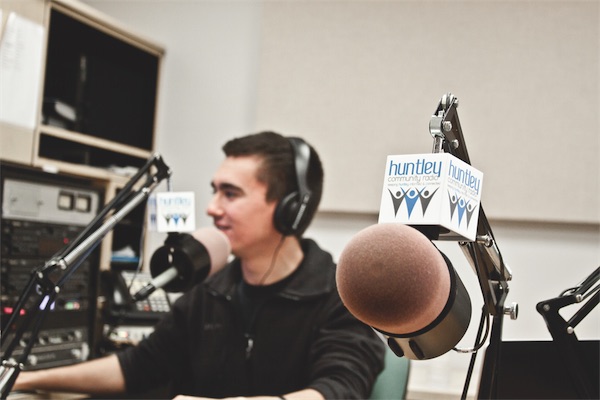 HCR intern Greg Hill broadcasting his show ‘Greg’s Classic Jams’ at HCR studios in Dieke Park. Hill is one of six HCR interns. (Photo by Chris LaPelusa/Sun Day)