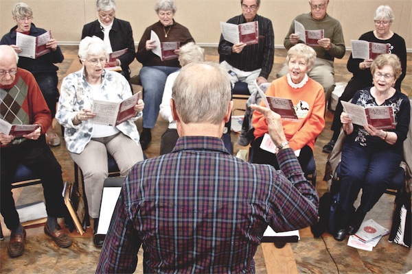 R.D. Holloman (foreground) leads The Prairie Voices at a recent rehearsal in Fount View last week. (Photo by Chris LaPelusa/Sun Day)