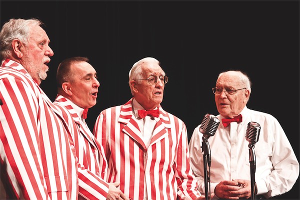 The Clef Hangers are a barbershop-style quartet. Here they’re warming up on Sunday, Feb. 8 in Huntley High School’s auditorium before an event featuring the a capella stylings of groups like The Clef Hangers and students. (Photo by Chris LaPelusa/Sun Day)