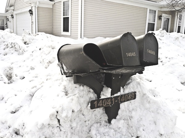 If not fixed promptly, damaged mailboxes from Village snow removal efforts may leave residents without mail. Enter Ron Johnston. (Photo provided)