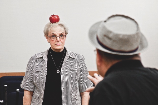 Judy Stage and Bob Gienko practice a ‘knife-throwing’ scene at a recent rehearsal. (Photo by Chris LaPelusa/Sun Day)