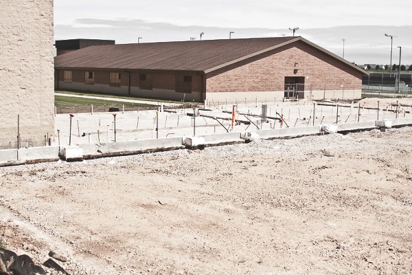 The foundation laid here is for HHS’ new fieldhouse, one of the construction additions part of the 39 million dollar proj- ect to serve an increase in student population in coming years. (Photo by Chris LaPelusa/Sun Day)
