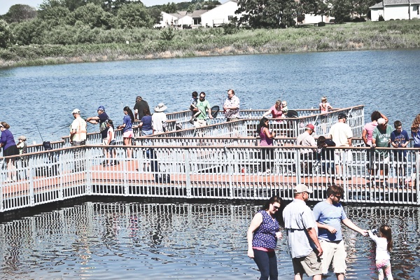 Generations of Sun City families, friends, and family gather for the Grandma Grandpa & Me Club and Angler’s Club Annual fishing derby. (Photo provided)