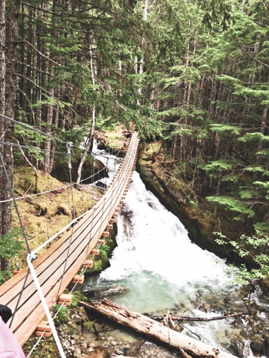 Crossing the swinging bridge at Butchart Gardens, a 55-acre garden inside an old quarry. (Photos provided)