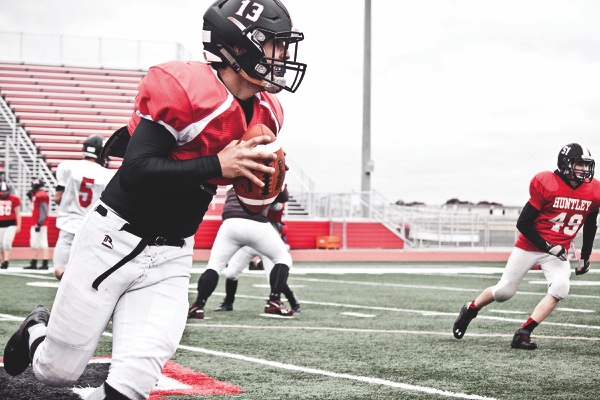 Senior QB Anthony Bine  drops back for a pass during prac ce rounds. (Photo by Chris LaPelusa/Sun Day)