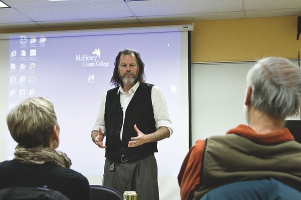 Faculty member Todd Culp discusses with RAP students his experiences in conflict zones around the world. (Photo by Chris LaPelusa/Sun Day)