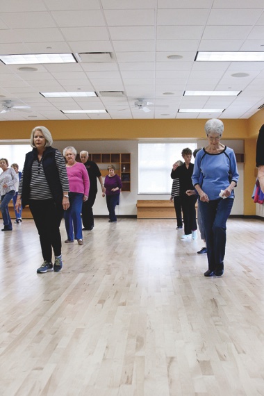 Members of Sun City’s line dancing fitness group get their steps in shape for their upcoming line dance party. (Photo by Chris LaPelusa/Sun Day)