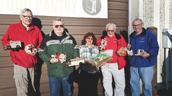 (Left to right) Woodchuck Rich Hamberg, Don Esperseth, Grafton Food Pantry volunteer Lydia Locke, Woodchuck Al LaPelusa, Jim Ji-nan. (Photo provided)