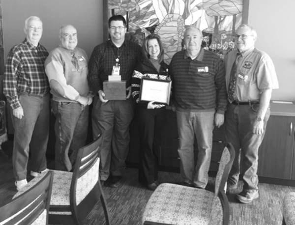 Woodchuck member Bill Ziletti (second from left) and other Woodchuck members after presenting the boxes to Centegra Chaplain Justin Searles (middle left) and Supervisor of Chaplains Dena Battaglia. (Photos provided)