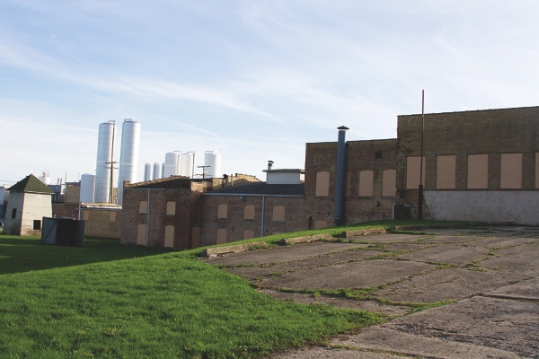 For a decade, as it’s sat abandoned, questions have abounded for what’s to come of the historic Catty Building. Village hopes for it to be part of its redevelopment. (Photo by Chris LaPelusa/Sun Day)