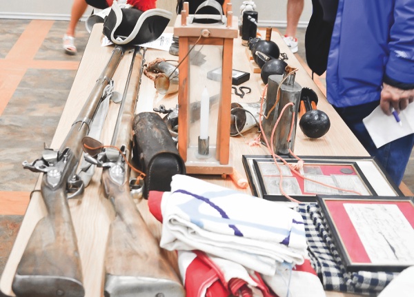 Items used in the Revolutionary War on display, during presentation. (Photo by Christine Such/Sun Day)