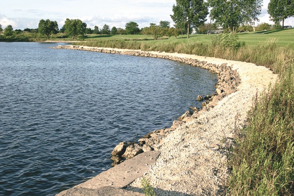 Shown here is the shoreline covered in a gravel called fines, which hardens quickly and handles well against ero- sion or submersion. It also provides a stable walking path. (Photo by Tony Pratt/Sun Day)