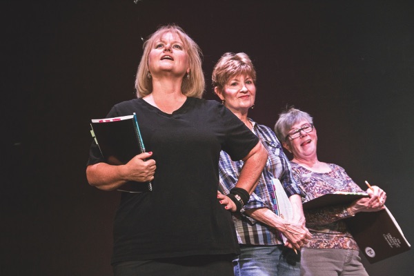 Front to back: Cynthia Church, Madge Motyka, and Marie Sieker gear up for their energetic roles as Rizzo, Marty, and Jan, respectively. (Photos by Tony Pratt/Sun Day)