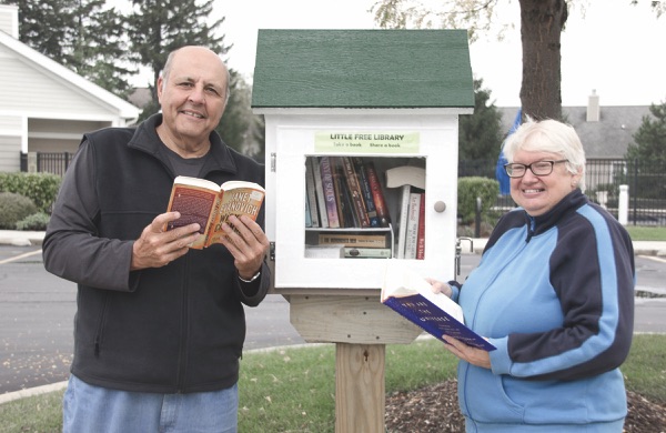 Vito and Linda Benigno will be stewards of this Little Library near the Meadow View outdoor swimming pool in Sun City. (Photo by Tony Pratt/Sun Day)