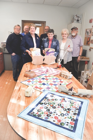 Sew n Sews and Woodchucks collaborate on holiday project donations. (Photo by Christine Such/Sun Day)