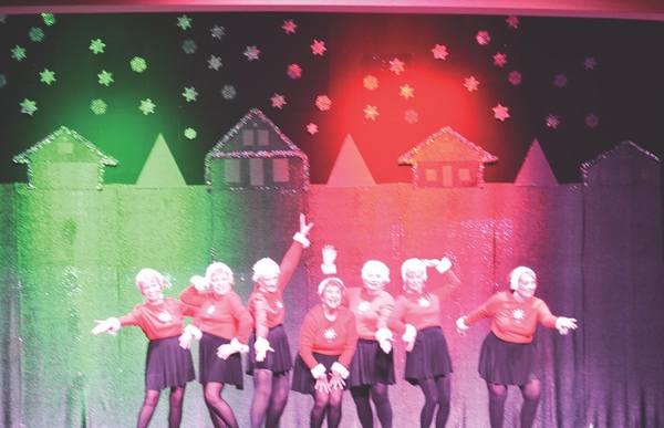 Strutters performing Feliz Navidad.