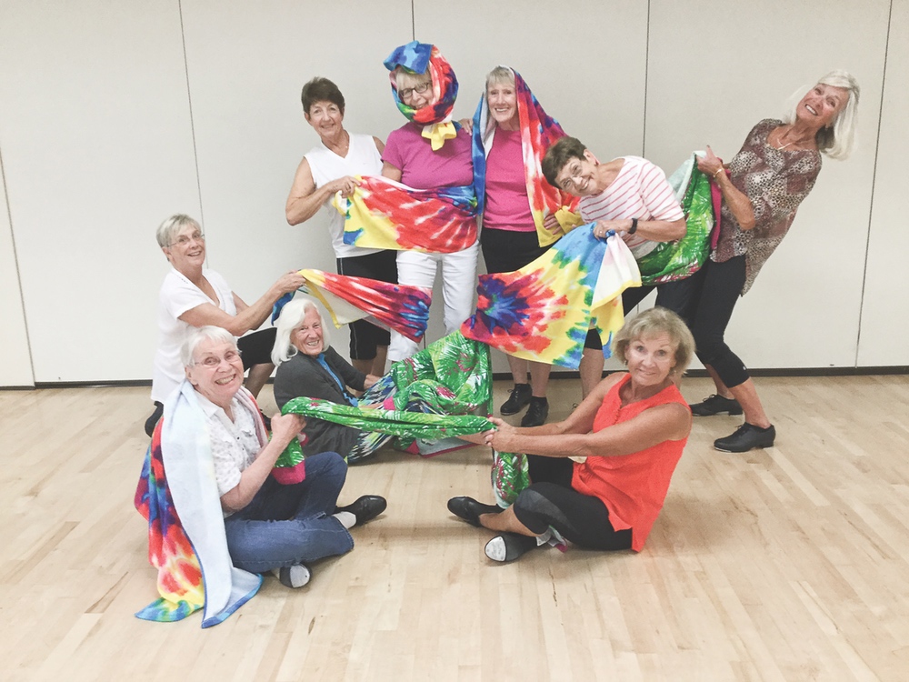 The Hoofers practicing their towel tricks for their Kokomo dance. Front row L to R: Lori Martiny, Lynn Hadlock, Dana Rich, Linda Pribla. Back row L to R: Donna Schnepff, Penny Anderson, Ann Larson, Barb Thompson, Sandy Oldham.