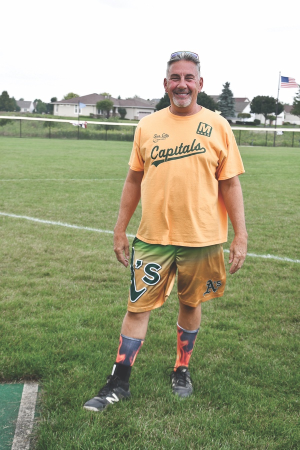 As a new player, Capital’s team member Chuck Hund wanted to stand out, so he opted for a pair of crazy socks. Today he has a variety of fifty pairs that he alternates between games. (Photo by Christine Such/Sun Day)