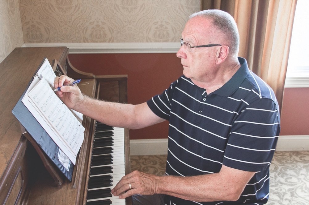 David Barth reviewing sheet music.. (Photo by Tony Pratt/Sun Day)