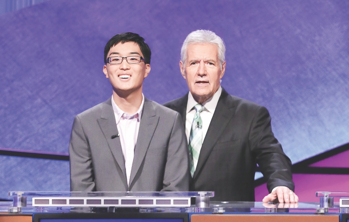 Tim Cho shown here with Alex Trebek while filming Jeopardy. (Photo provided)
