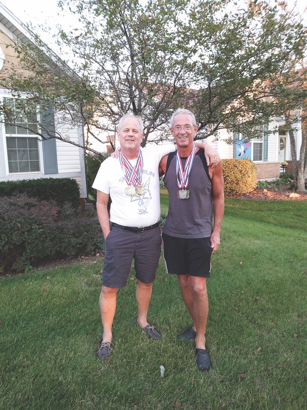 Mark Schark (left) and Len Lencioni with their medals. (Photo provided)