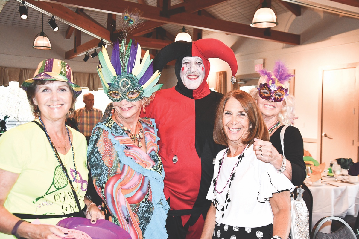 Tennis Club members donned Mardi Gras attire for their annual party. (Photo by Christine Such/Sun Day)