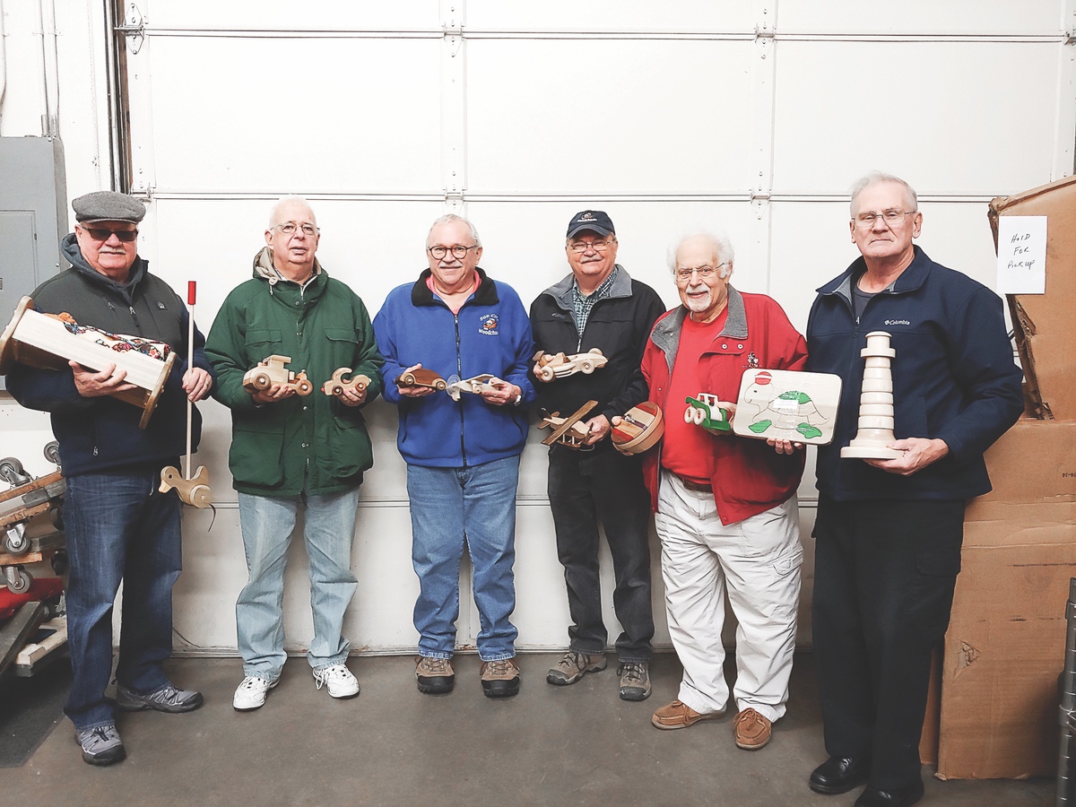 Left to right: Sun City Woodchucks Ray Harris, John Sterling, Jim Moran, Ed Cutler, Al LaPelusa and Ken Szymura delivered beautifully hand crafted toys for Christmas presents for the children of Food Pantry families. (Photo provided)