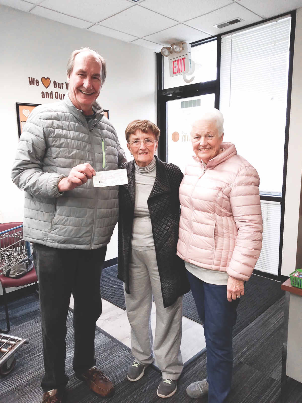 Dick and Pat Storer presenting a $547 check to the Grafton Food Pantry’s Nancy Horney. This money was the profit from the candy and water sales from the play, "South Pacific." (Photo provided)