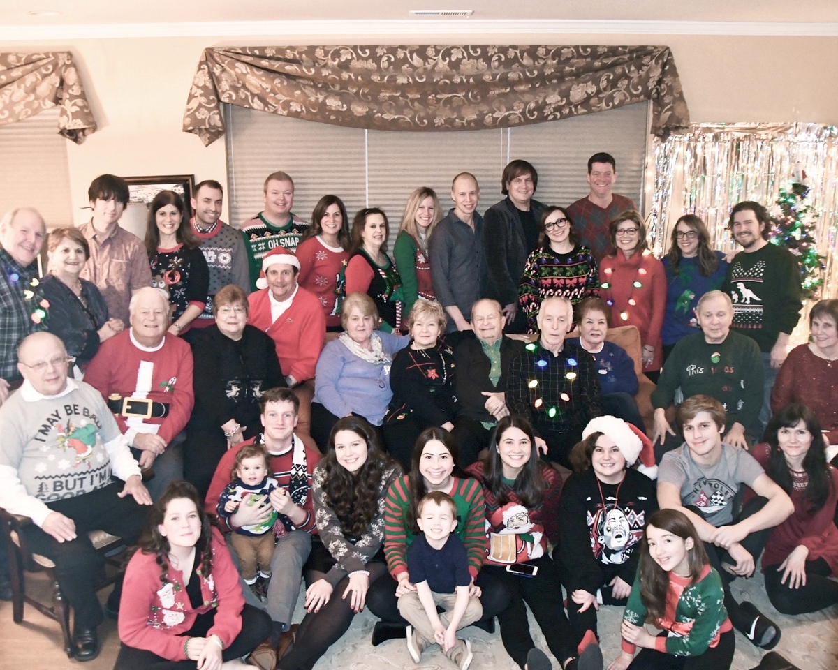 The Bellaks/Benkers/Koziors show off their ‘ugly’ Christmas sweaters. (Photo by Christine Such/Sun Day)