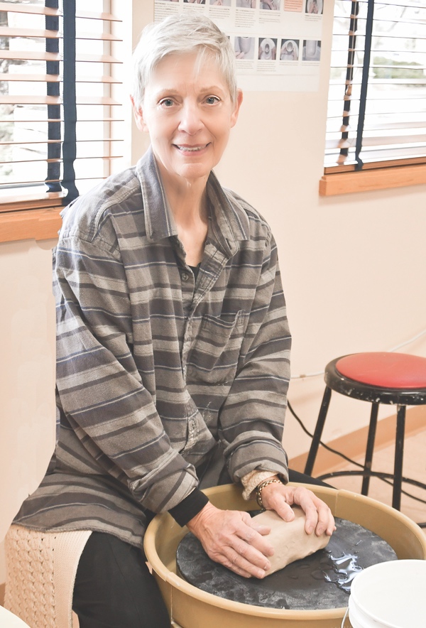 Clayground member Cathleen Chay at the Potter’s Wheel, planning the Clay projects for May 5th. (Photos by Christine Such/Sun Day)