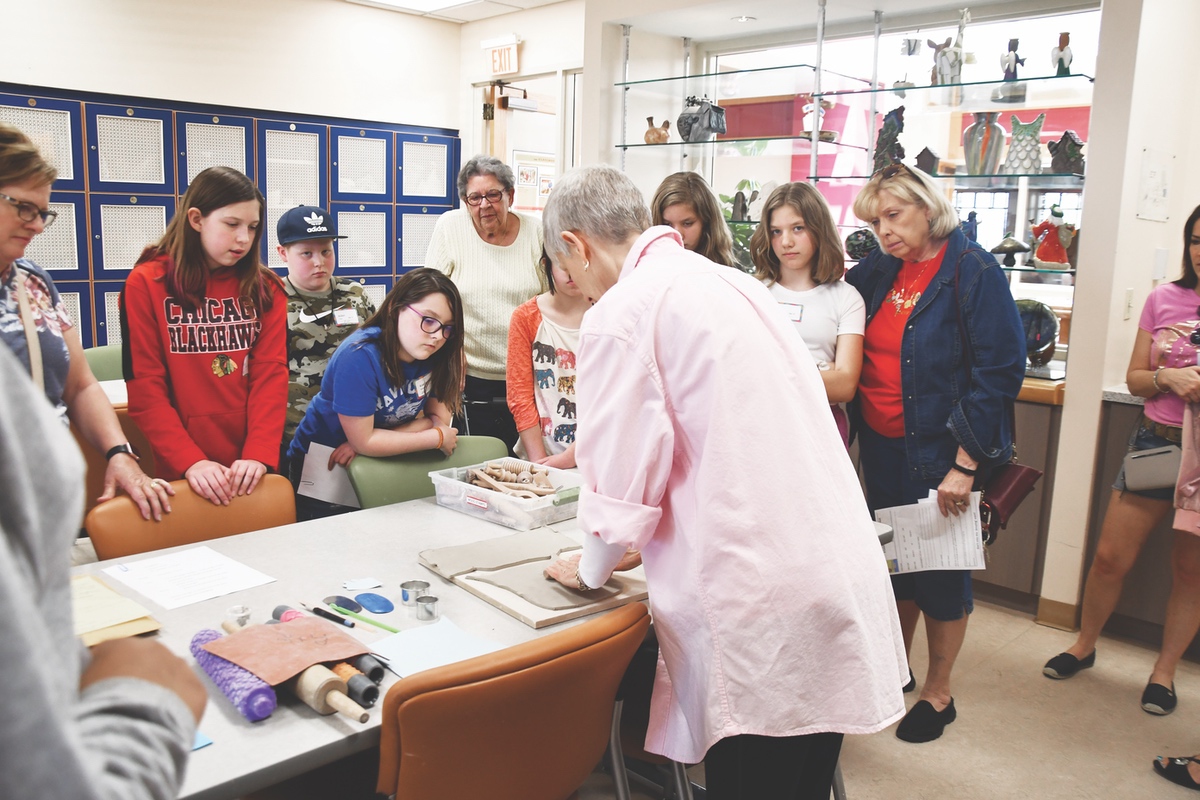 Cathleen Chay (front) demonstrates instructs older grandkids.